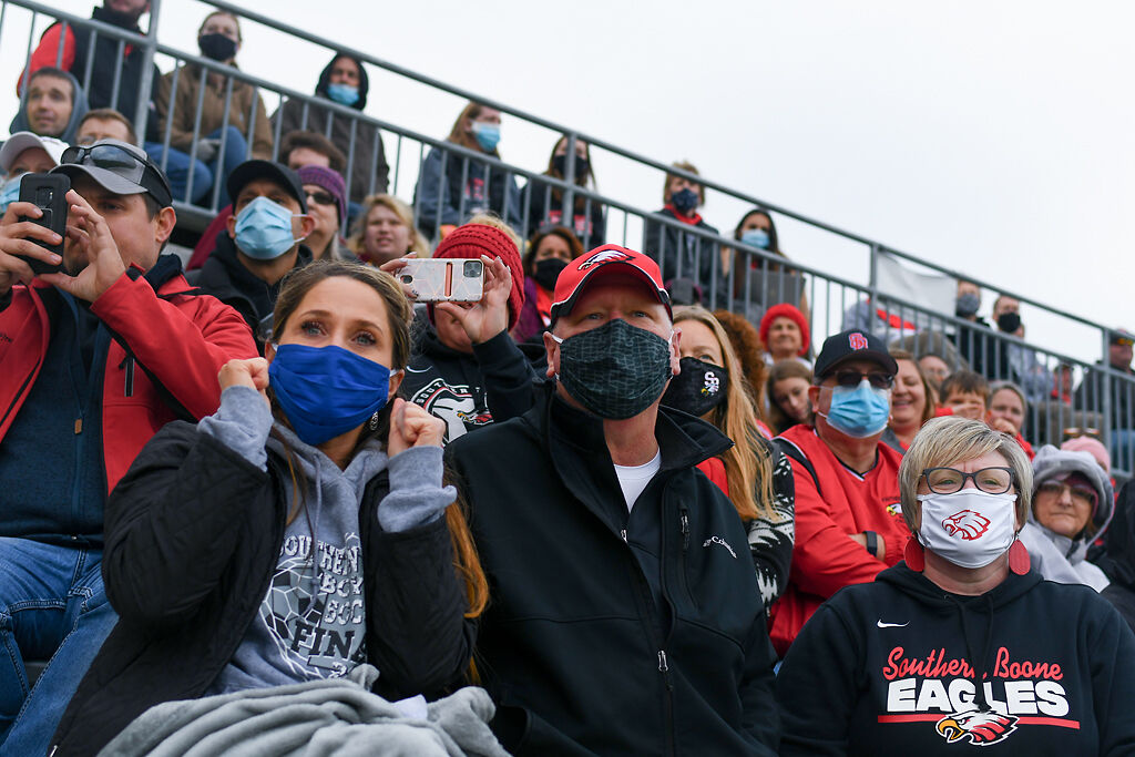 Southern Boone High School supporters Amanda Lake, Erich Beeson, and Michele Sapp watch their team